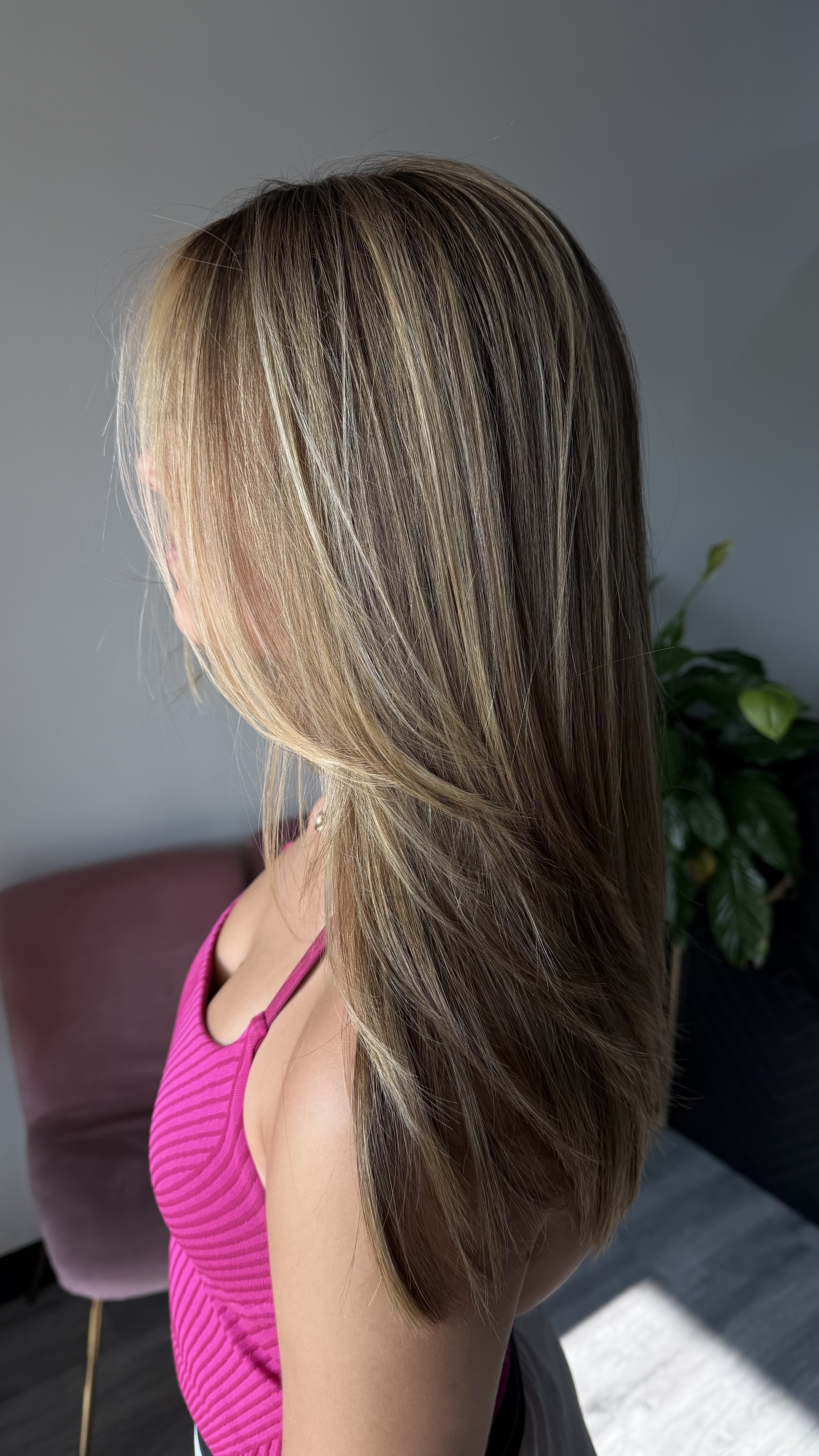 Warm brunette waves with subtle face-framing dimension